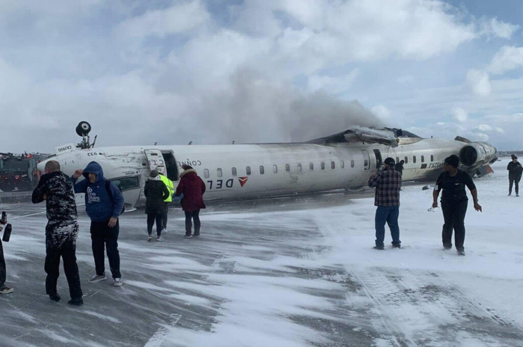 Delta Air Lines regional jet flips upside down after landing at Toronto Pearson International Airport, injuring 18 passengers. Photo credit: Reuters
