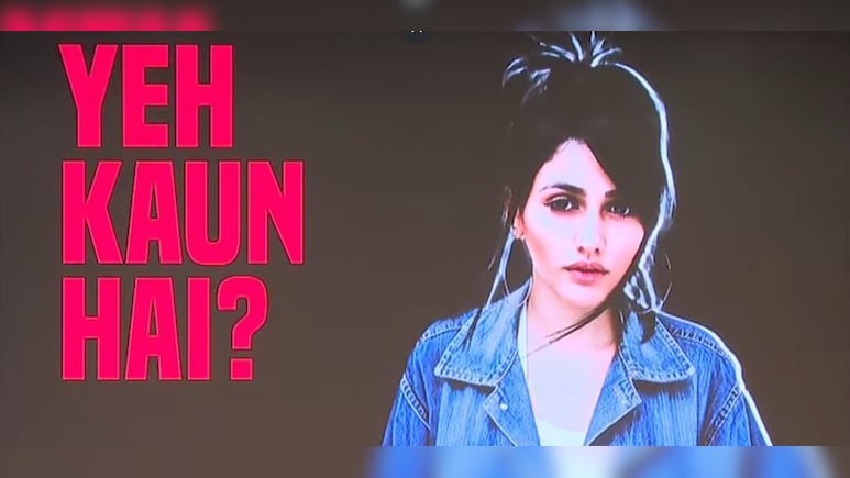 Rahul Gandhi displays a voter list photo during his ‘H-Bomb’ press conference, alleging that a Brazilian model’s image appeared multiple times in Haryana’s electoral rolls. (PC: NDTV)