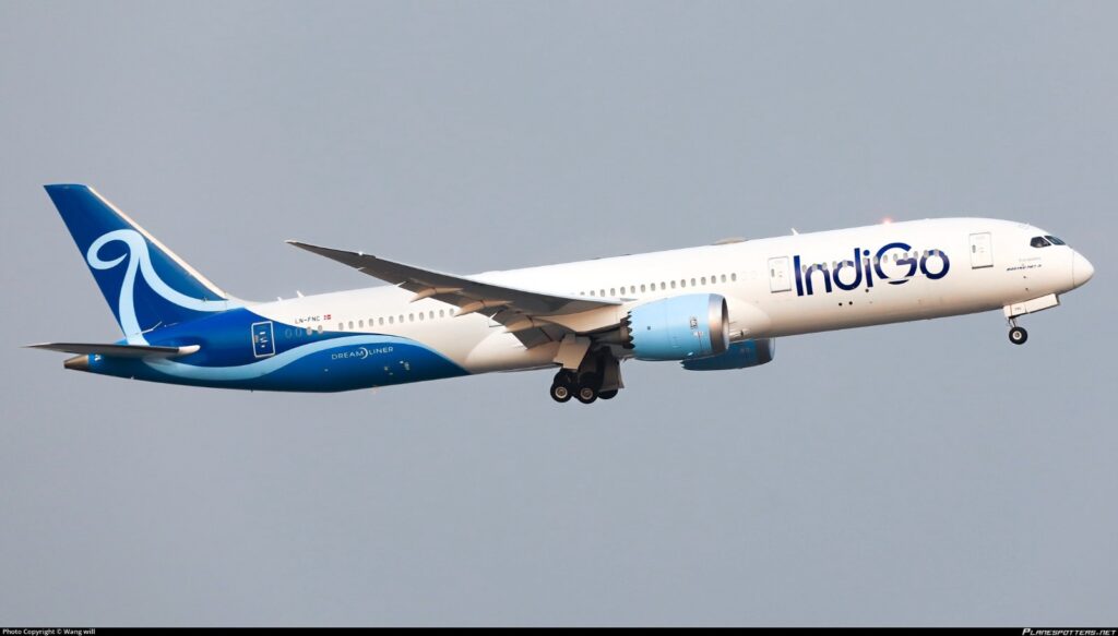 An IndiGo aircraft in flight, as the airline issues a travel advisory warning of possible delays due to dense fog and reduced visibility across parts of North and East India.
