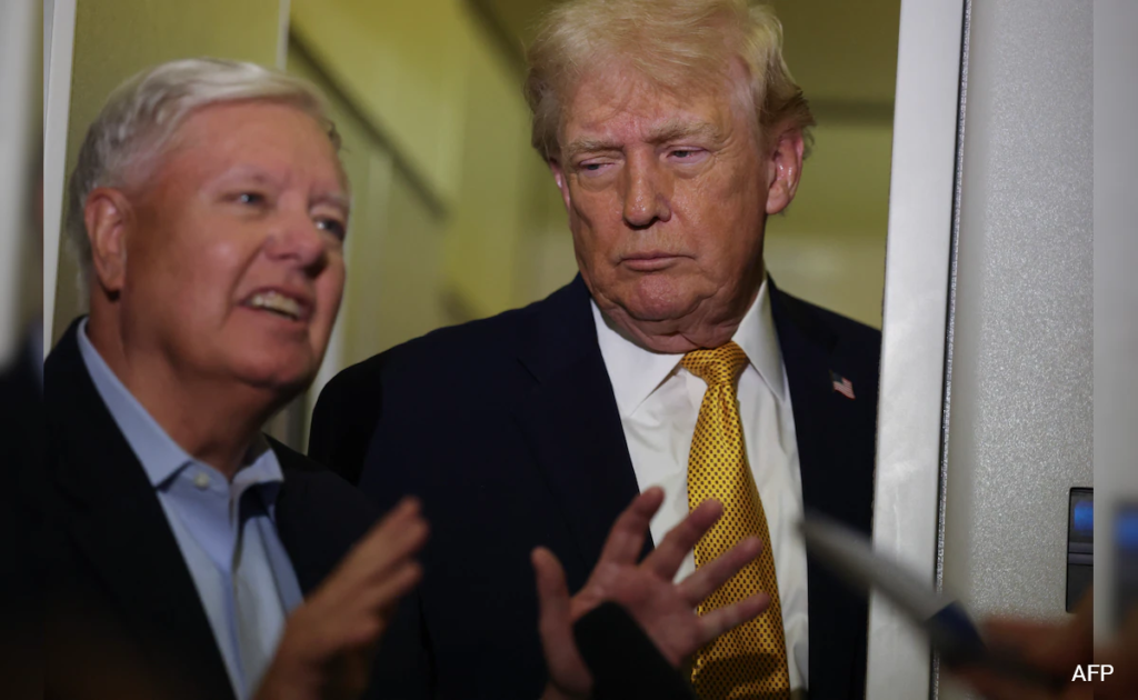 US Senator Lindsey Graham speaks to reporters as former President Donald Trump listens, following a closed-door meeting on Capitol Hill regarding proposed sanctions targeting Russia and countries importing Russian energy. (Photo Credits: AFP)
